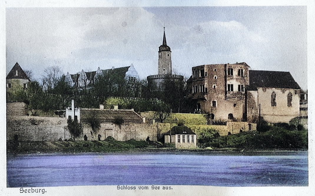 Historische Postkarte: Schloss Seeburg vom See aus, mit Witwenturm, um 1920